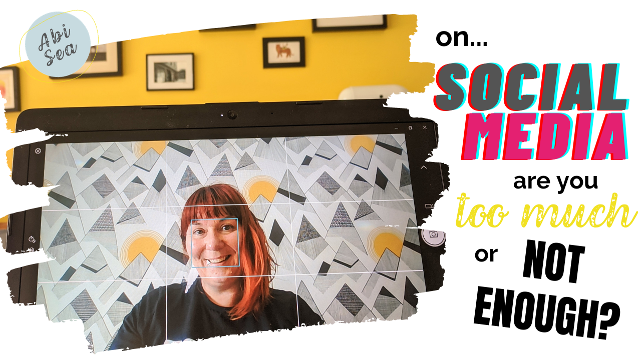 woman with red hair sits in front of yellow and black wall